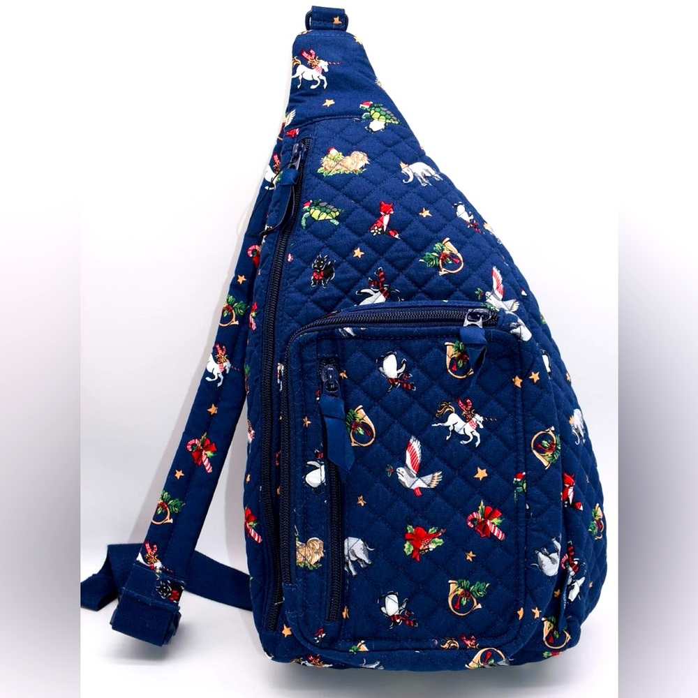 Vera Bradley Sling Backpack in Snow Globe Motifs Pattern Navy Blue, NWT.